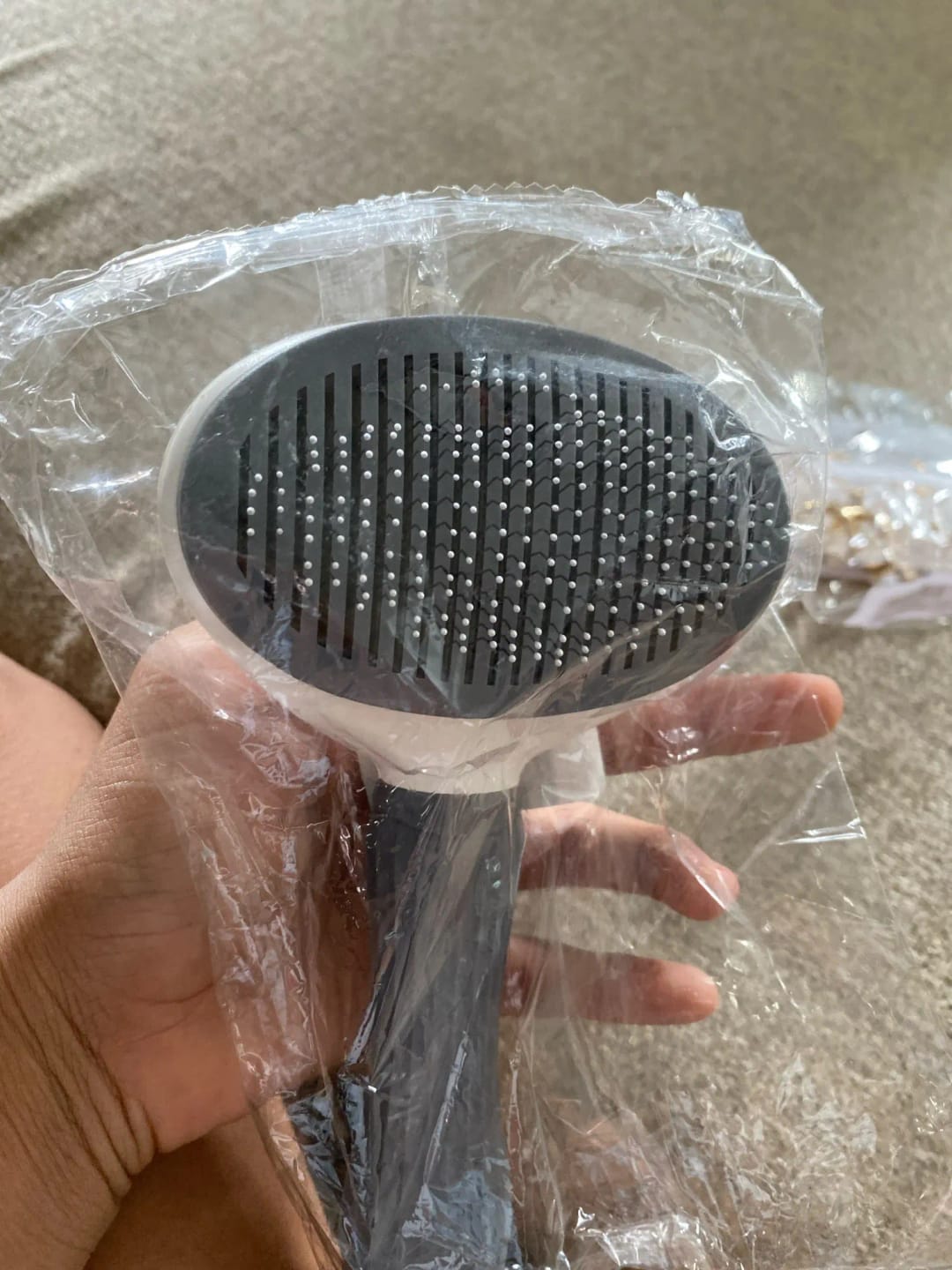 Customer photo review of Self Cleaning Pet Grooming Brush for Dogs and Cats