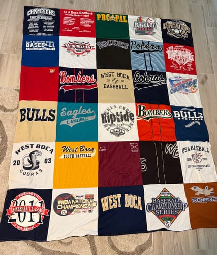 Customer's large T-Shirt Quilt made from a collection of colorful baseball and sports tournament t-shirts.