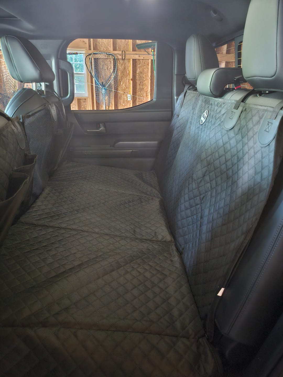 Customer photo review of NEW Waterproof Hard Bottom Car & Truck Seat Foldable Hammock Cover With Storage Pockets, Side Flaps, Headrest Straps, Seat Anchors, & Mesh Window (+FREE SAFETY BELT!)