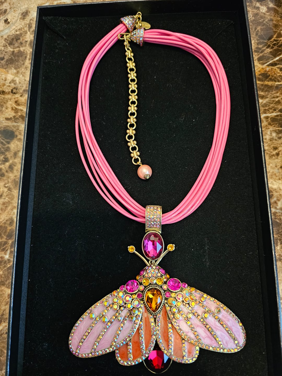 Customer photo review of HEIDI DAUS® “Butterfly Embrace” Butterfly Enhancer Pendant with Leather Cord Necklace