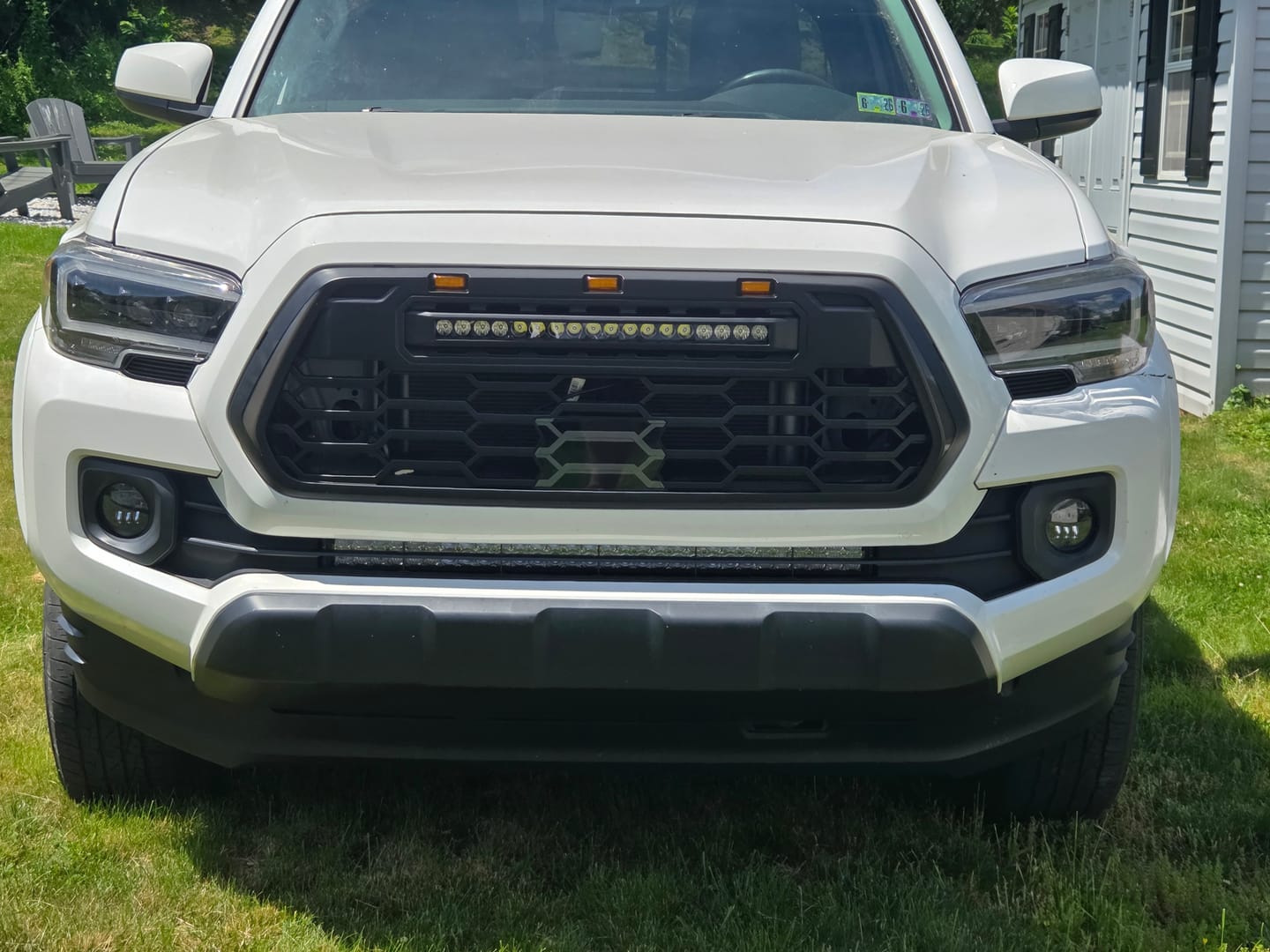 Customer photo review of 2016-2023 Tacoma Apex Pro Style Grille with LED Light Bar & Raptor Lights by YotaTribe
