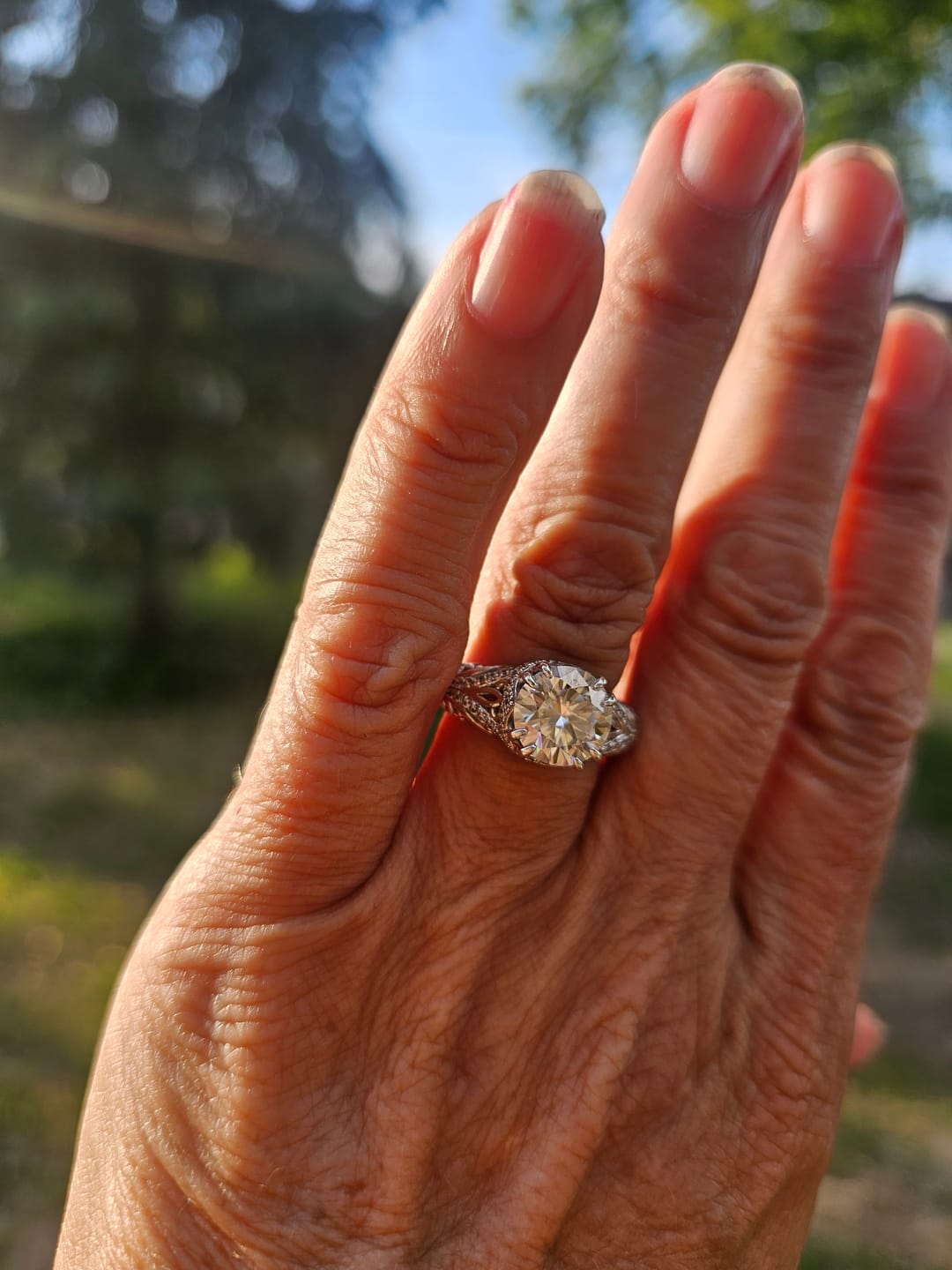 Customer photo review of Vintage Moissanite Pave Open Scroll Accents Engagement Ring