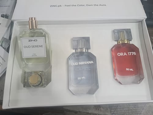 Customer's OUD Supreme BUNDLE showing the three perfume bottles, Oud Serene, Oud Nirvana, and Ora 1776, in their white box.