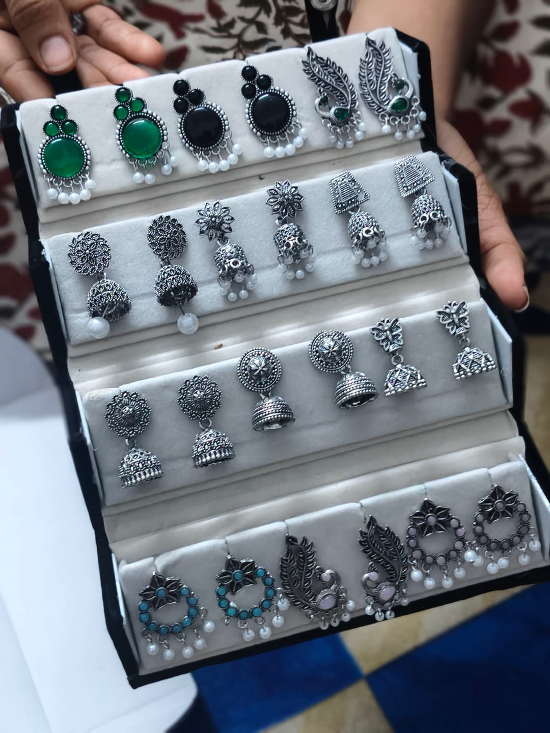 Customer photo review of Set of 12 Random Earrings with Folding Jhumka Box