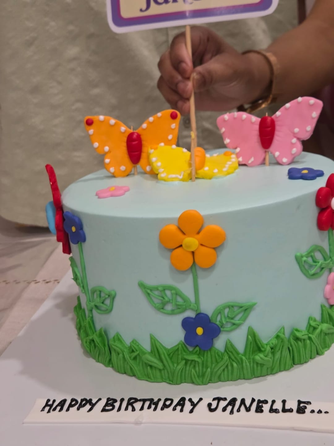 Customer photo review of Flowers and Butterflies Cake
