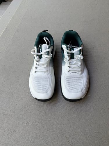 Customer's white and green CUURT Muuv shoes shown from the front, highlighting the wide toe box.