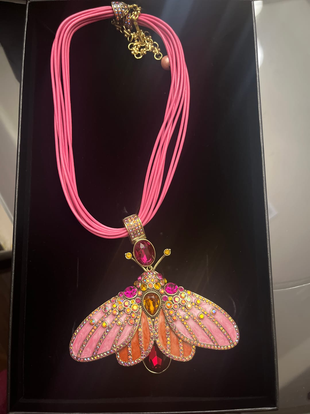 Customer photo review of HEIDI DAUS® “Butterfly Embrace” Butterfly Enhancer Pendant with Leather Cord Necklace