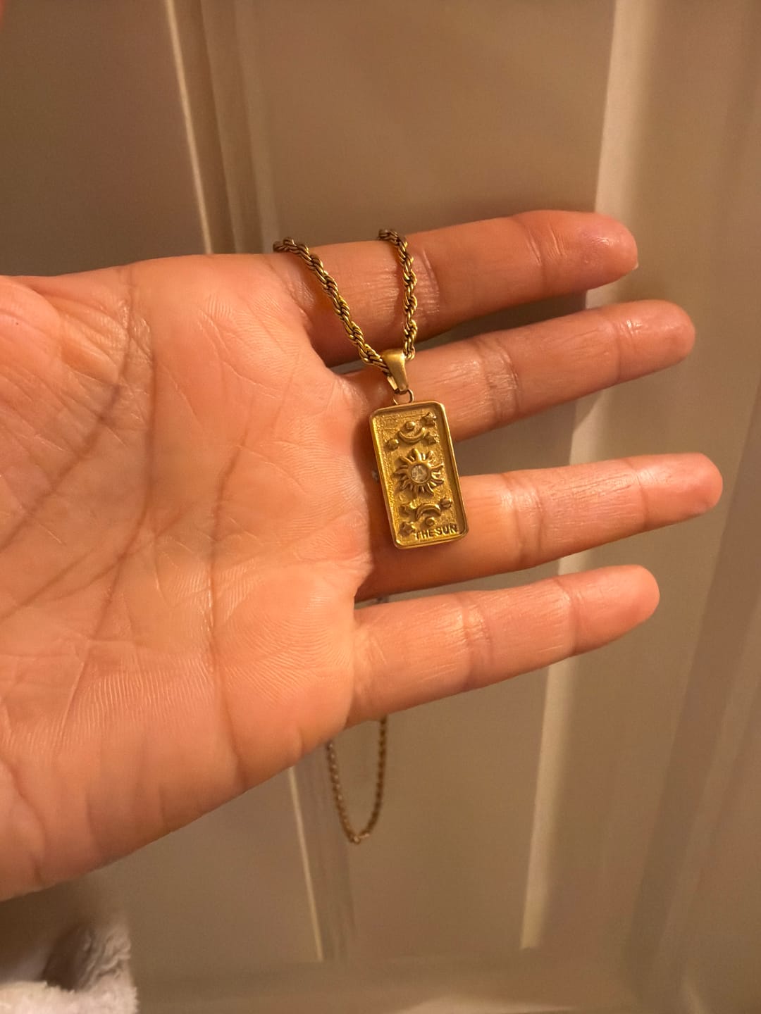 Customer photo review of ‘The Sun’ Tarot Pendant Necklace