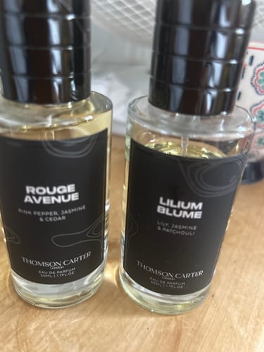 Customer's Lilium Blume Eau de Parfum bottle next to the Rouge Avenue perfume mentioned in the review.