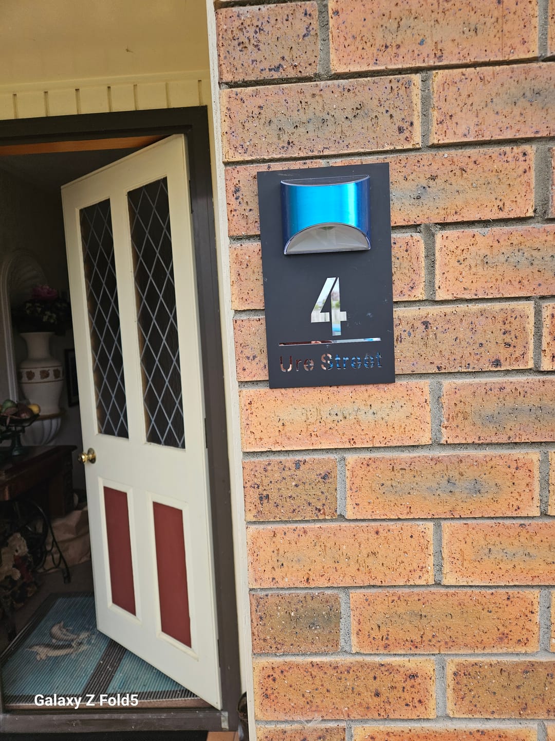 Customer photo review of WhareLite™ | Personalized Address Plaque