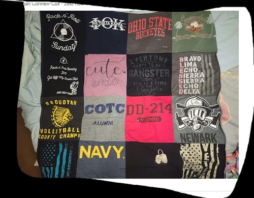 Customer's personalized Project Repat T-Shirt Quilt featuring patches from college, military, and high school shirts.