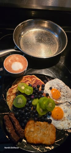 Customer’s pan beside a cooked breakfast