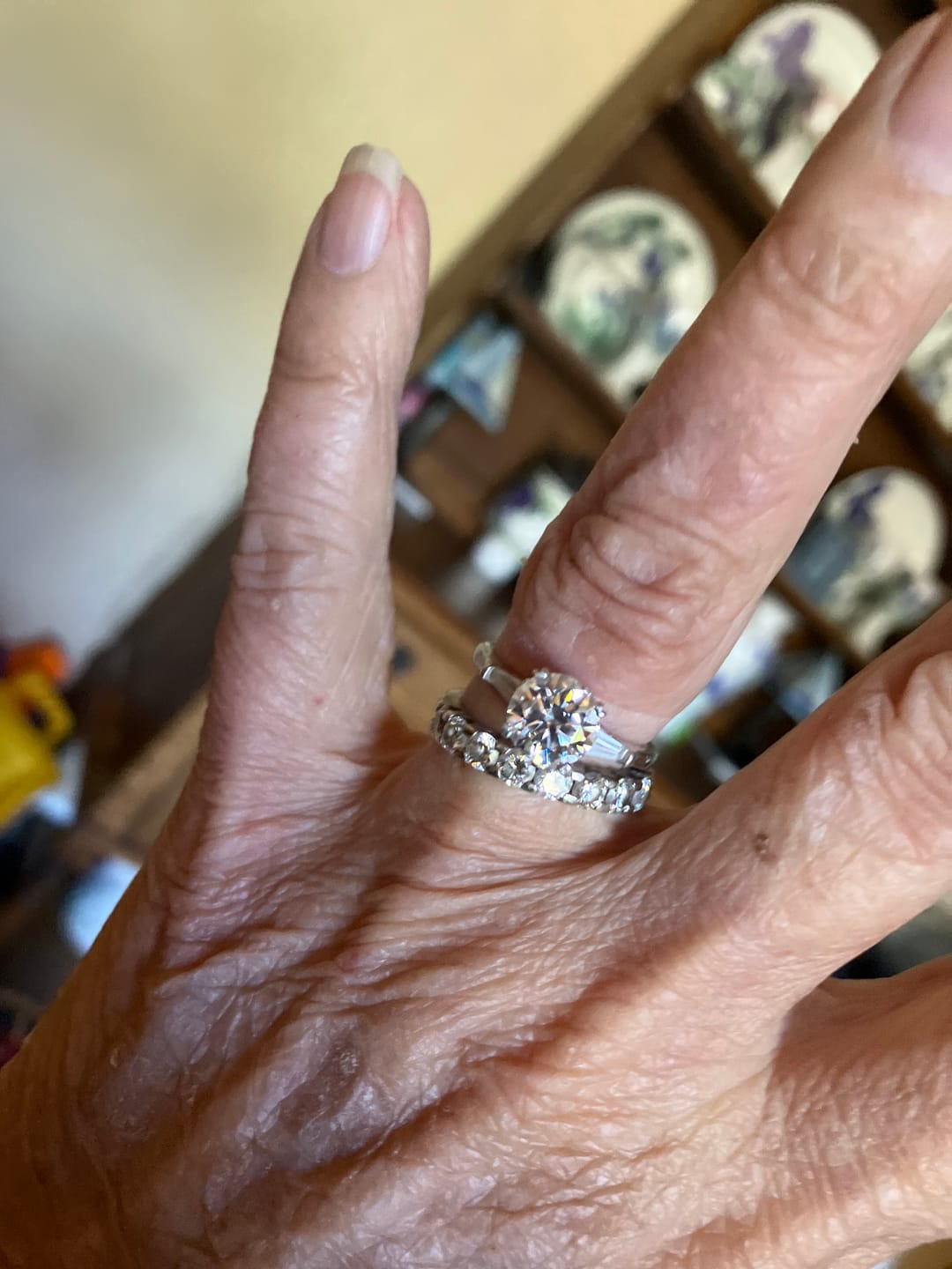 Customer photo review of Three Stone Round Moissanite Tapered Baguette Engagement Ring