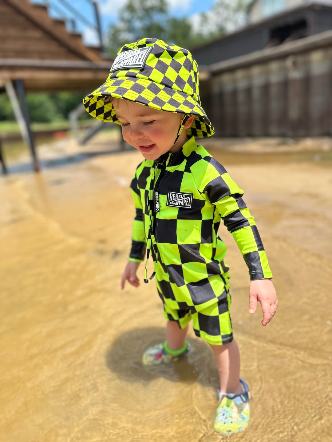 Customer photo review of UPF50+ Boys Swim Romper in Neon Electric Lime + Black Checkered
