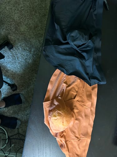 Reviewer's black and red stone Seamless Briefs laid out on a dark surface, showing the pouch design.