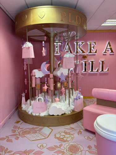 Customer showing the beautiful pink interior for their Walk Ins visit, with a decorative carousel display.