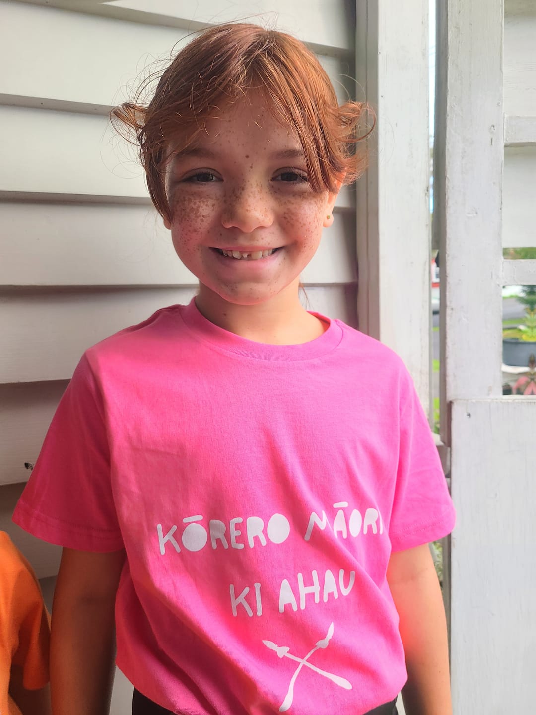 Customer photo review of Kōrero Mai Print Child Tee - Orange
