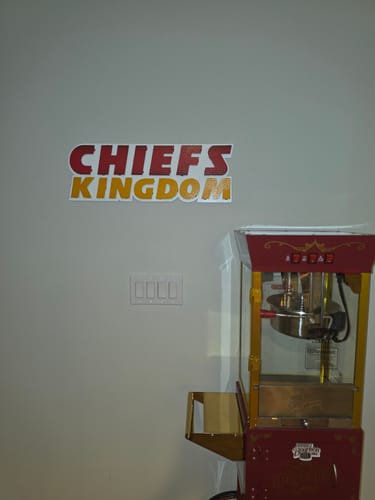 Customer's 'CHIEFS KINGDOM' 3D vintage wall art mounted on a wall in their room.