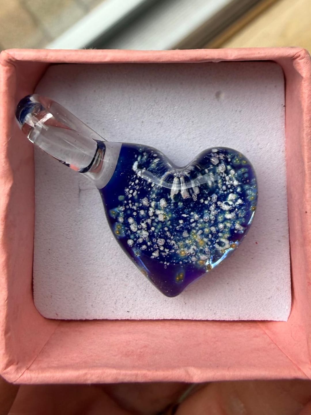 Customer photo review of Blue Starburst Pendant with Infused Cremation Ashes