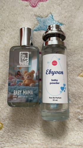 Customer photo comparing a Dua Baby Mama bottle with the original fragrance