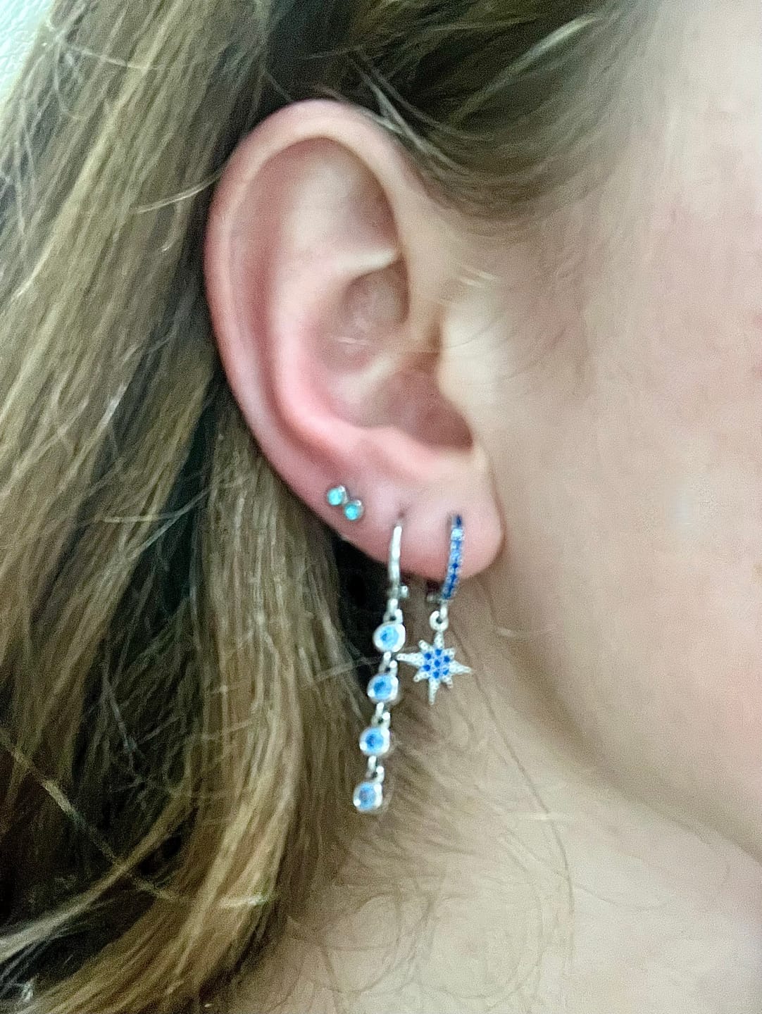Customer photo review of Cosima Blue Silver Star Huggie Earrings
