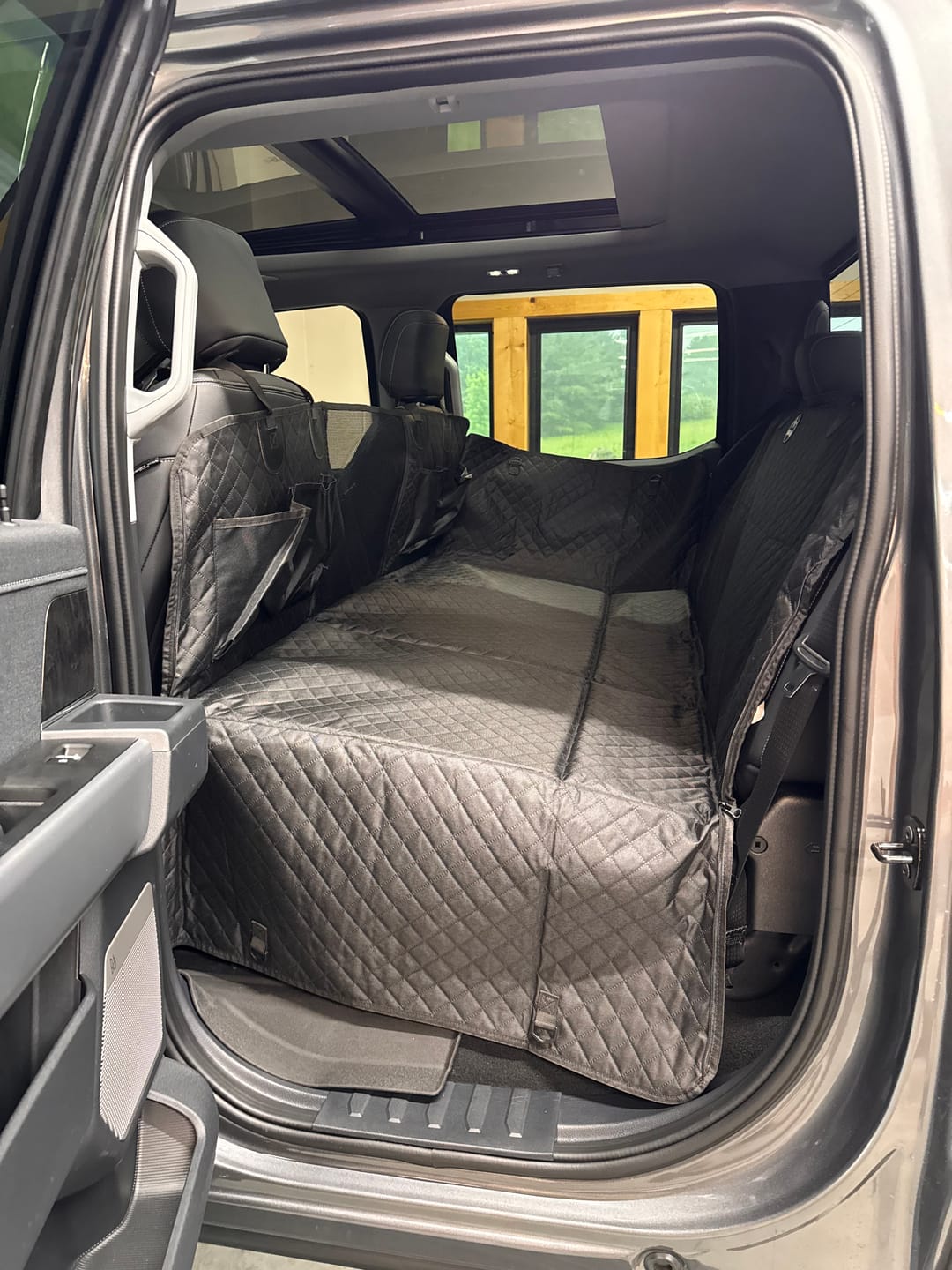 Customer photo review of NEW Waterproof Hard Bottom Car & Truck Seat Foldable Hammock Cover With Storage Pockets, Side Flaps, Headrest Straps, Seat Anchors, & Mesh Window (+FREE SAFETY BELT!)