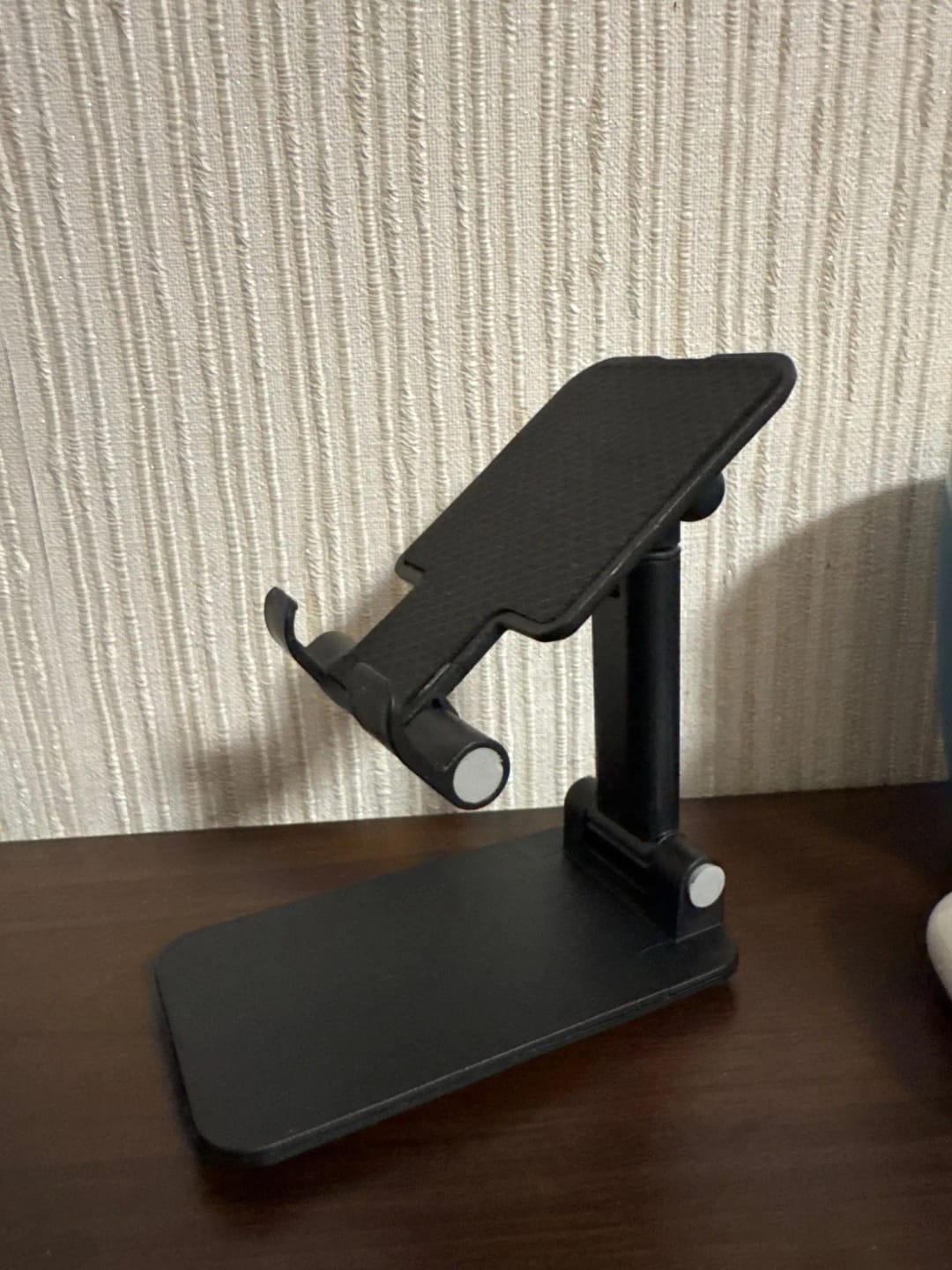 Customer photo review of Adjustable Phone & Tablet Stand – Universal Foldable Desk Holder