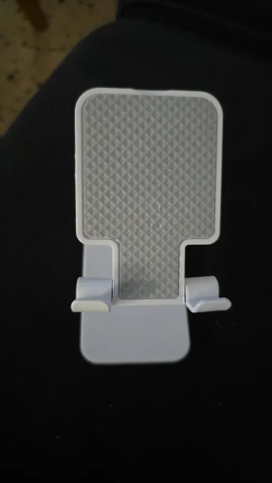 Customer photo review of Adjustable Phone & Tablet Stand – Universal Foldable Desk Holder