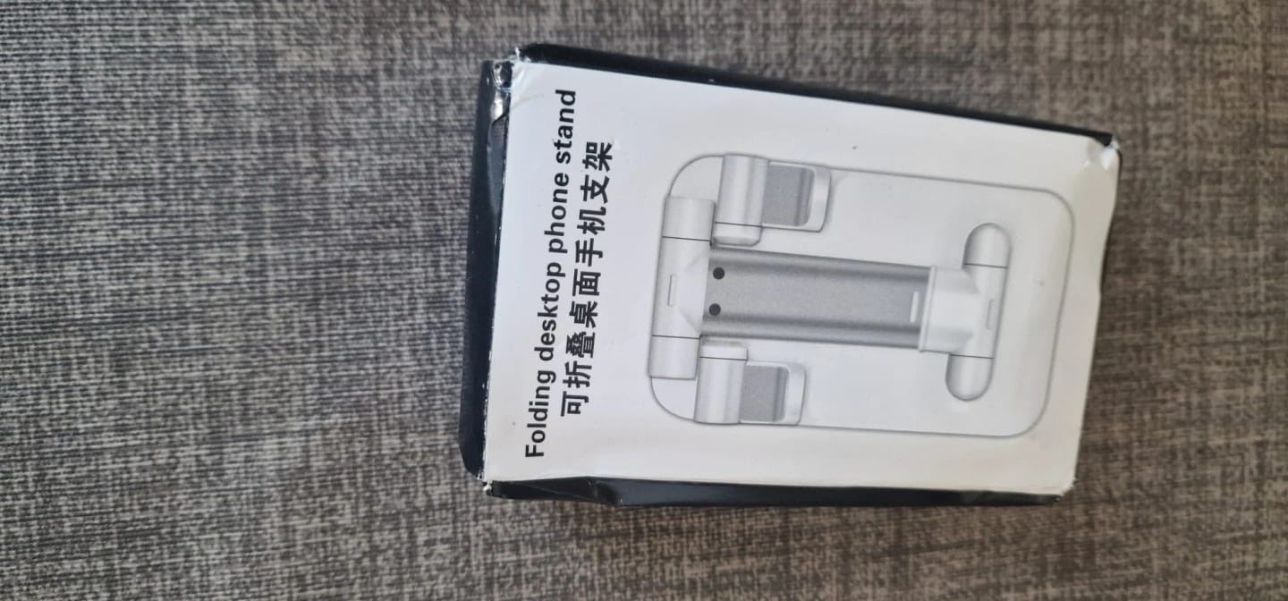 Customer photo review of Adjustable Phone & Tablet Stand – Universal Foldable Desk Holder