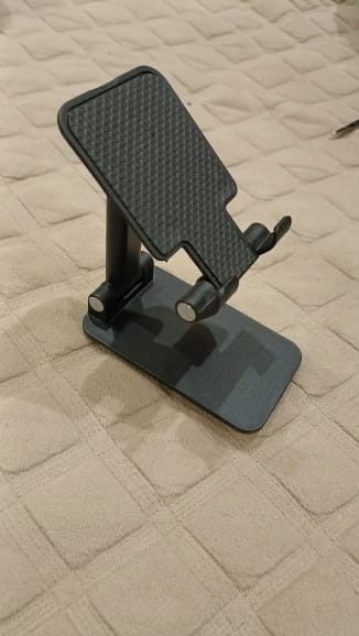 Customer photo review of Adjustable Phone & Tablet Stand – Universal Foldable Desk Holder