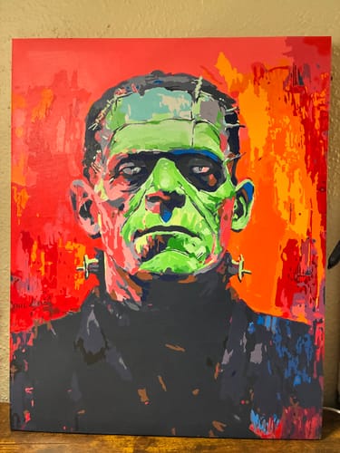 Customer's completed Frankenstein's Monster paint by numbers portrait with bold red and green colors.