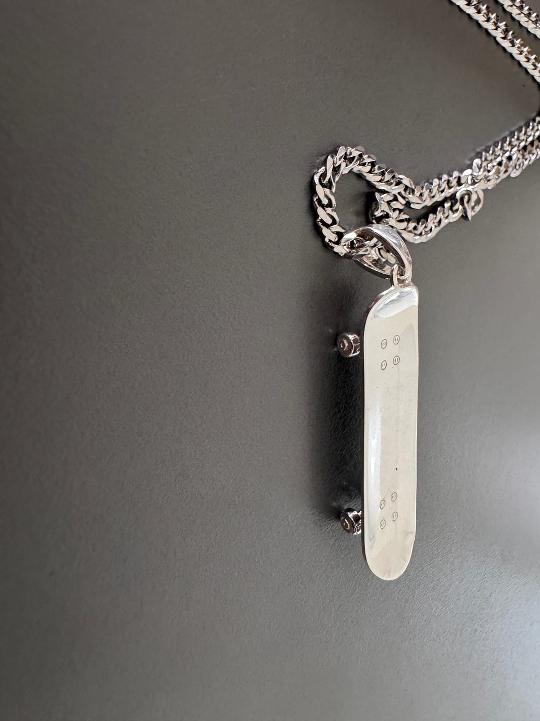 Customer photo review of Personalized Skateboard Pendant (Silver)