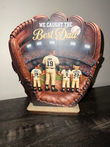 Customer's personalized wooden plaque shaped like a baseball glove, showing a dad and three children in a stadium scene.