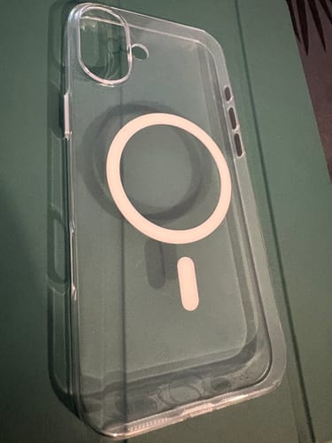 Reviewer's Anti Yellow Magsafe Clear Case, showing the white MagSafe ring and aluminum side buttons.