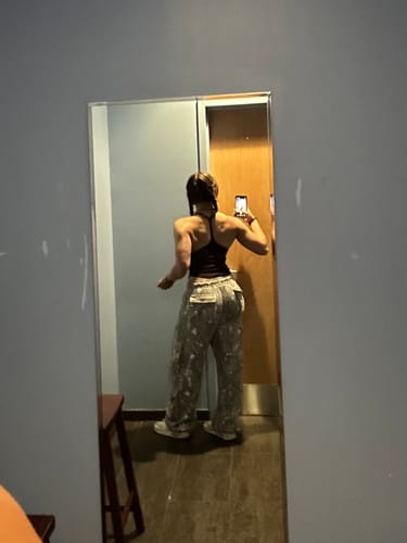 Reviewer from behind, showing the accentuating and baggy fit of the W251 Hunting Season Cargo Joggers in a mirror.