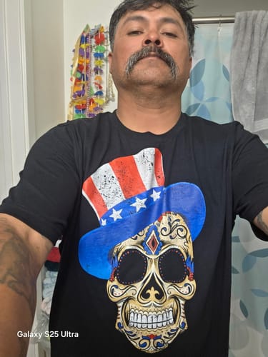 A reviewer wearing the black 4th of July American Sugar Skull t-shirt.