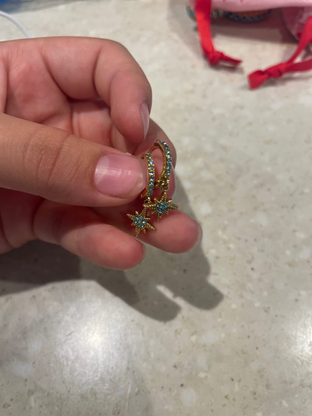 Customer photo review of Cosima Turquoise Gold Star Huggie Earrings