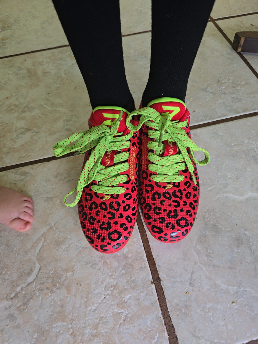 Customer photo review of Phenom Elite Quantum Carbon Football Cleats – Red Leopard