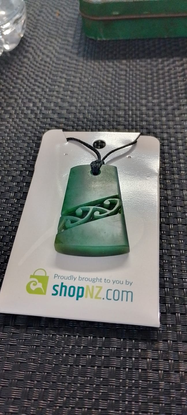 Customer photo review of Genuine NZ Greenstone Toki Necklace with Kowhaiwhai Carving