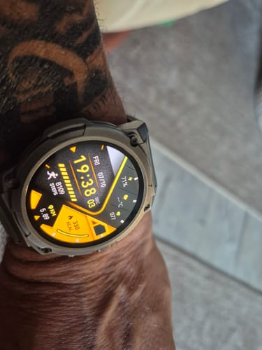 Customer's Gard Pro Ultra watch on their wrist, showing the bright yellow and black digital display with fitness data.