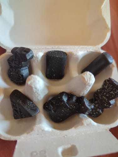 Customer's Salty Liquorice Mix, with six assorted pieces portioned into a small egg carton for rationing.