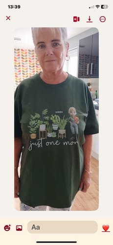 A customer wearing the dark green 'Just One More Plants - Personalized T Shirt' with its custom graphic.