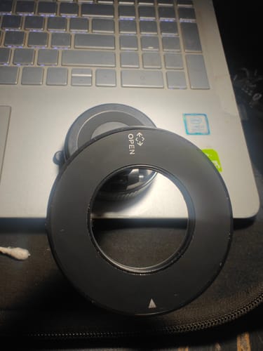 Customer's close-up of the black ring component for the MagPro Magnetic Phone Holder placed on a laptop.