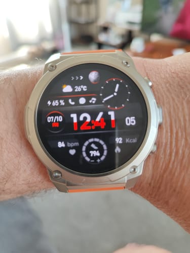 Customer's Gard Pro Ultra 3 watch on their wrist, showing a digital face with a silver case and an orange strap.