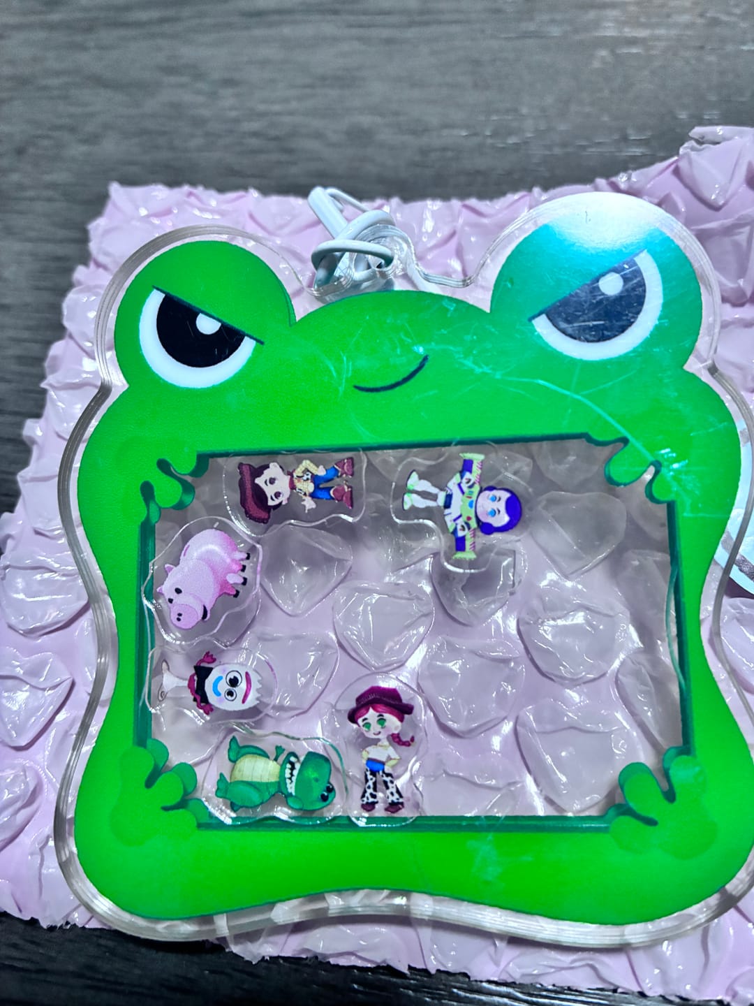 Customer photo review of Lilypad Toy Story 5 Shaker Keychain – Acrylic Disney Pixar Bag Charm with Cloud Carabiner