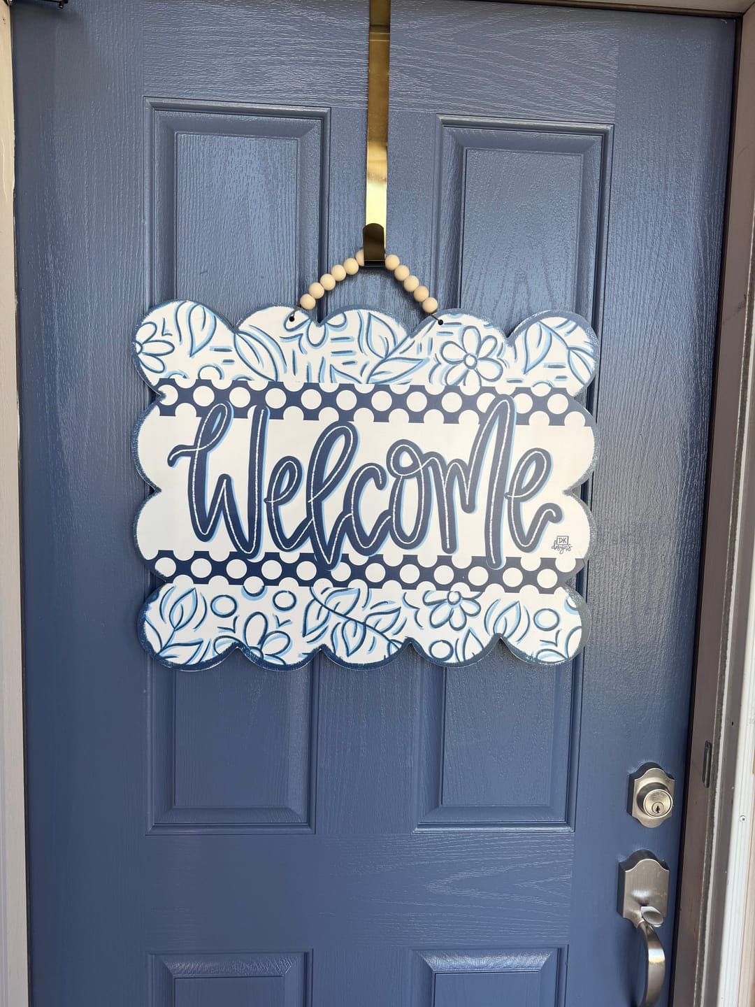 Customer photo review of Blue and White Scallop Welcome Door Hanger