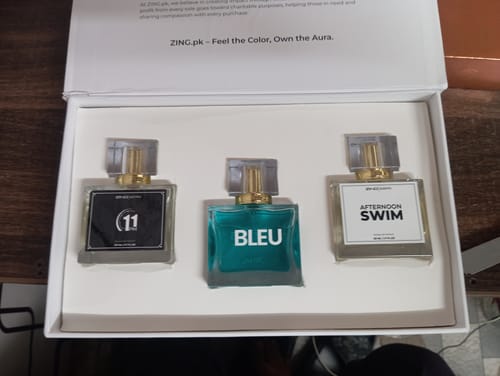 Reviewer's OUD Supreme BUNDLE showing three different perfume bottles arranged in a white presentation box.