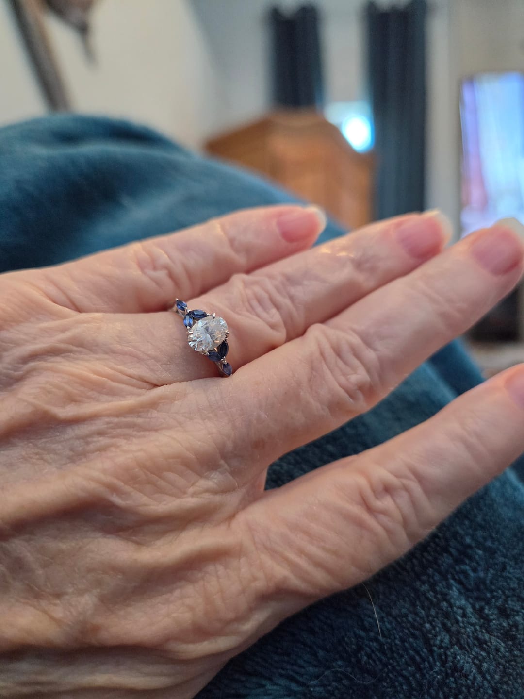Customer photo review of Oval Cut Moissanite With Marquise Sapphire Petals Accents Engagement Ring