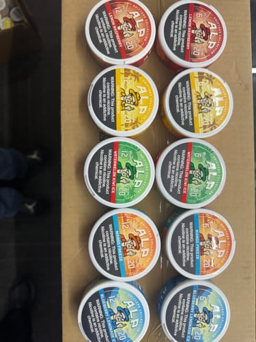 Customer's collection of various ALP Drifters nicotine pouches, including Lemon Raspberry, arranged in a box.