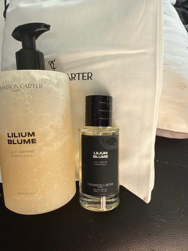 Customer's 50ml Fragrance & Body Wash Bundle, showing both the perfume and matching body wash in front of a cloth bag.